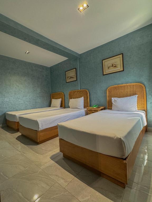 Postel nebo postele na pokoji v ubytování Jimmy Pyramids Hotel