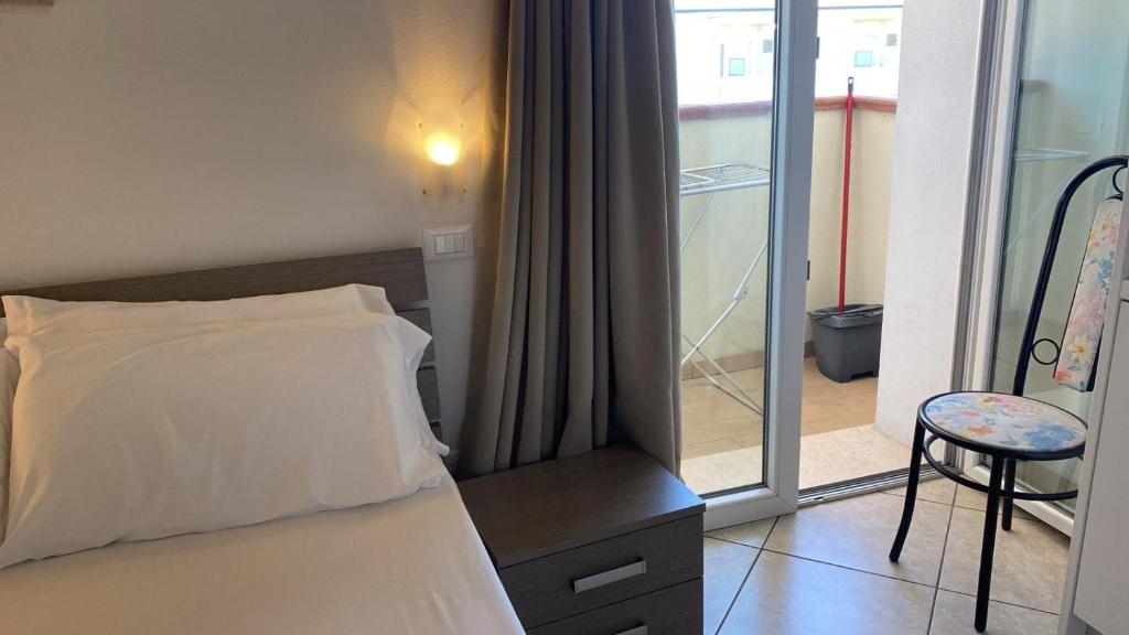Postel nebo postele na pokoji v ubytování Residence VAPORE