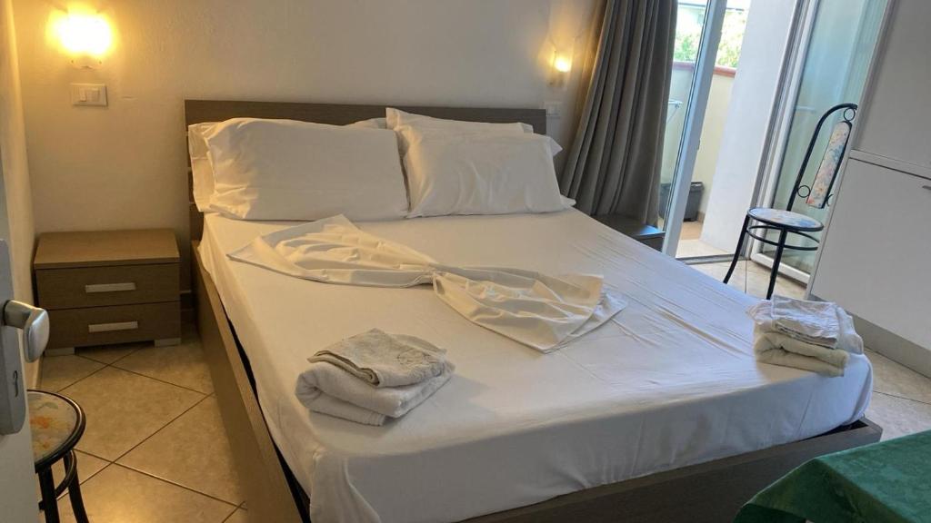 Postel nebo postele na pokoji v ubytování Residence VAPORE