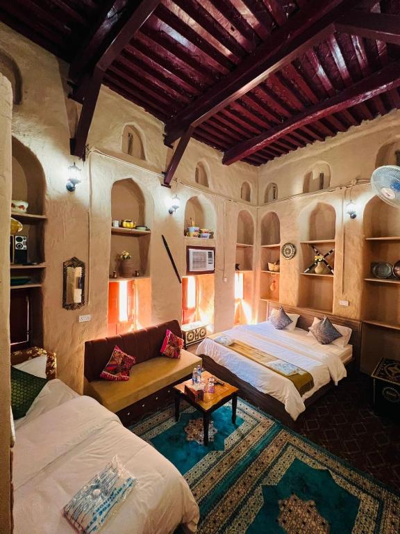 Postel nebo postele na pokoji v ubytování Al Misfah Hospitality Inn