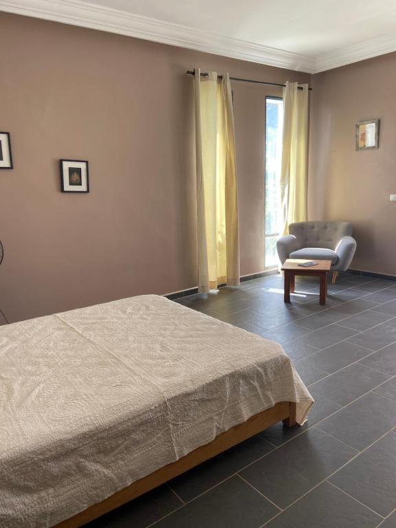 Postel nebo postele na pokoji v ubytování Dar Harmattan