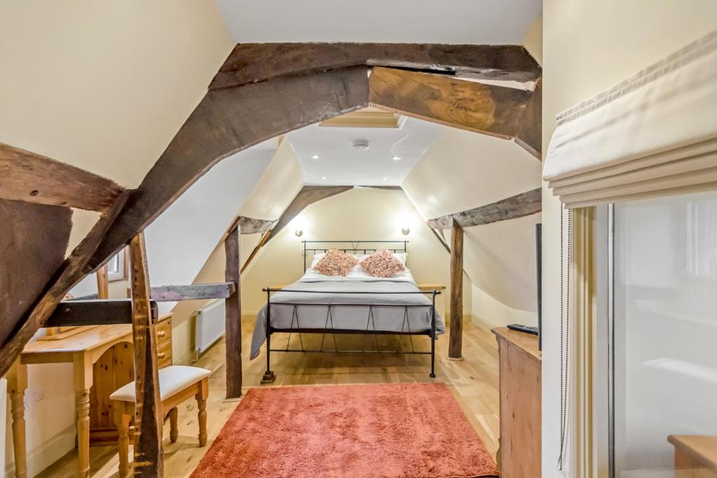 a bedroom with a bed in a attic at 15A St Giles with parking in Norwich