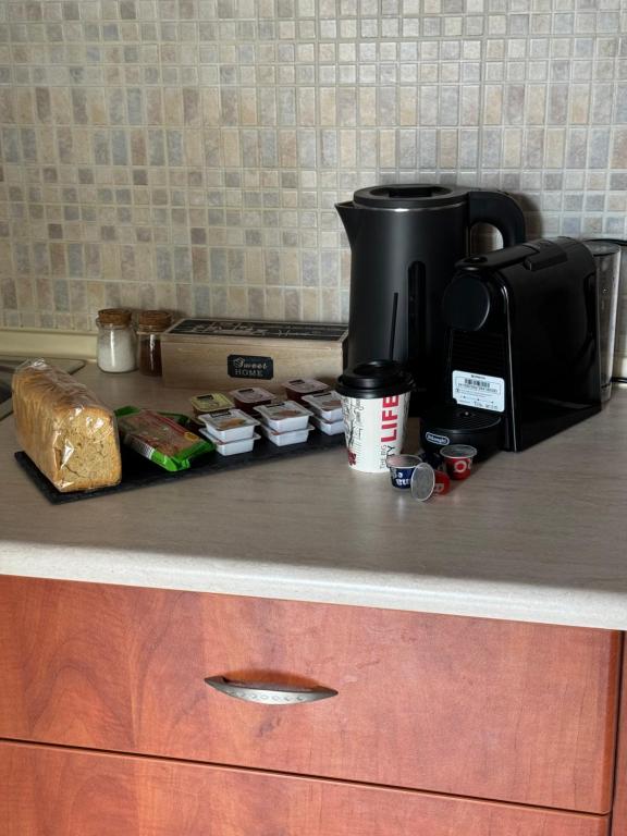 Příslušenství pro přípravu čaje a kávy v ubytování R&K MODERN APARTMENT