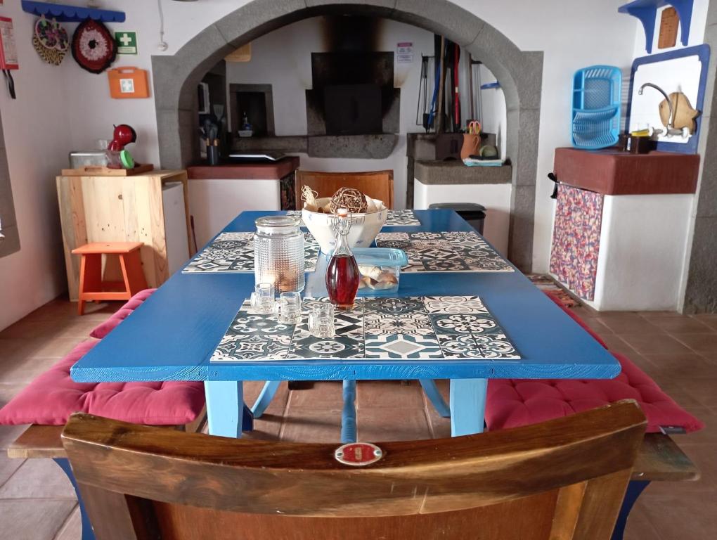 a table with a blue table cloth on top of it at Casa da Lapa in Angra do Heroísmo