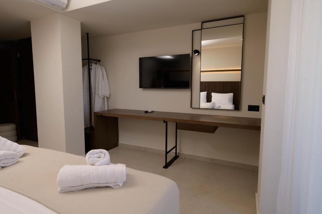 Postel nebo postele na pokoji v ubytování The Z Suites
