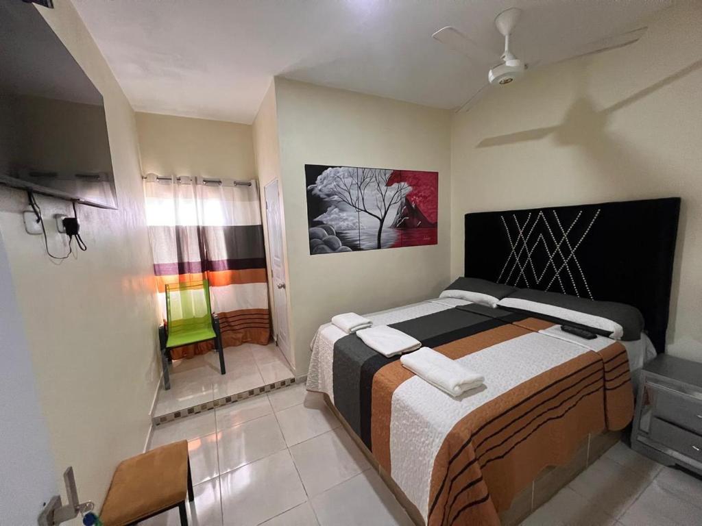 Postel nebo postele na pokoji v ubytování Hotel El Parque Constanza