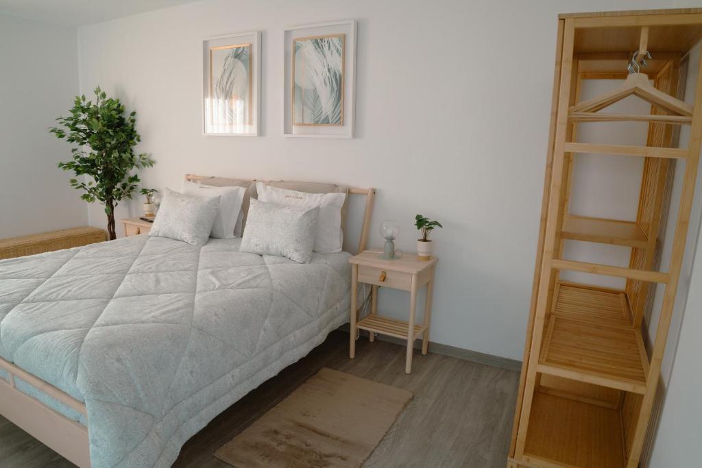 a bedroom with a bed and a book shelf at Casa do Carriço in Peso da Régua