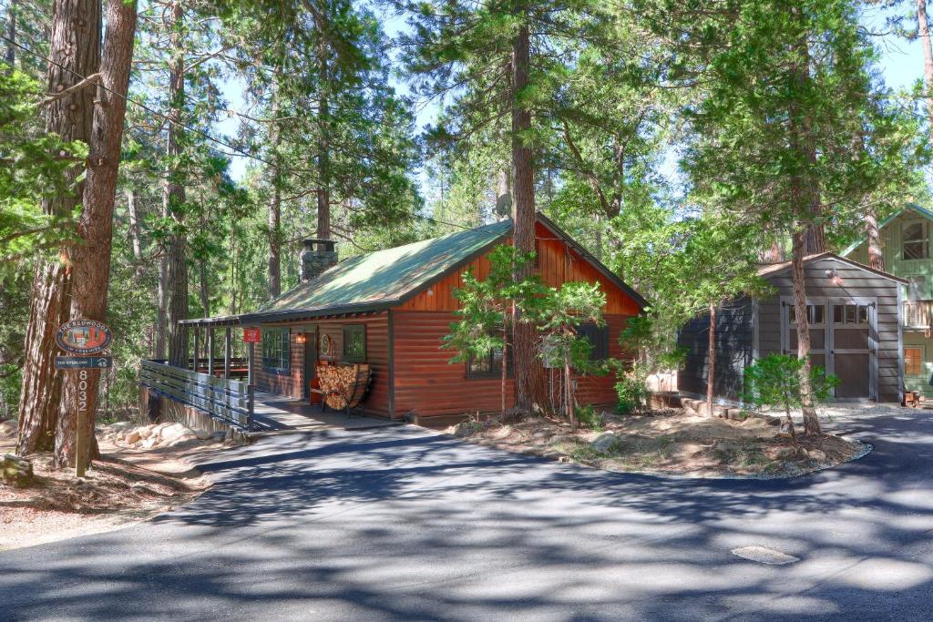 a small cabin in the middle of a forest at 45 The Overlook in Wawona