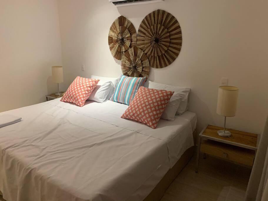 Posteľ alebo postele v izbe v ubytovaní Bahia Lodge - Apartamento privativo no Rio Vermelho