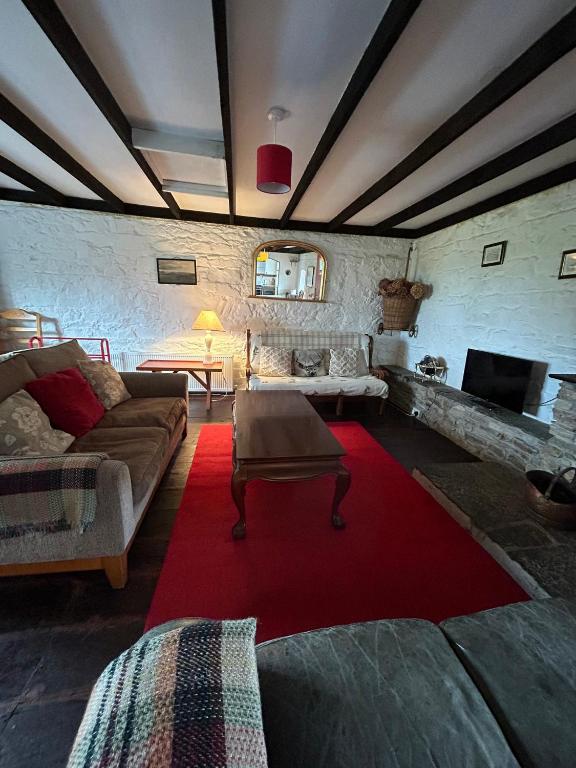 Posezení v ubytování Cleggan Farm Holiday Cottages