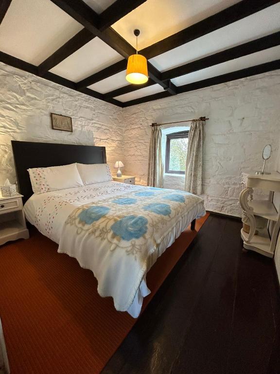 Postel nebo postele na pokoji v ubytování Cleggan Farm Holiday Cottages