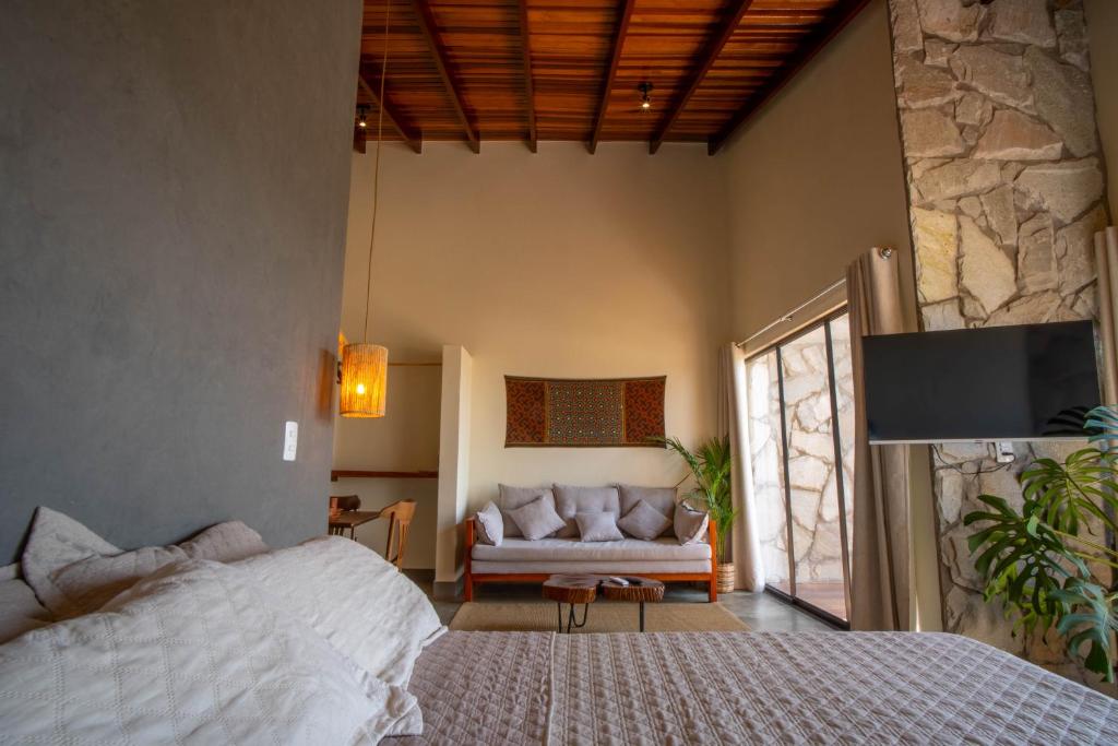 Postel nebo postele na pokoji v ubytování Lofts Lobo Guará