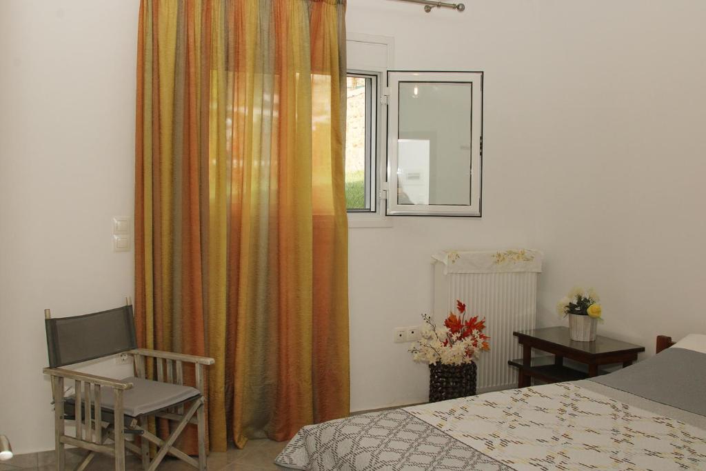 Postel nebo postele na pokoji v ubytování Vagelis Nemea apartments