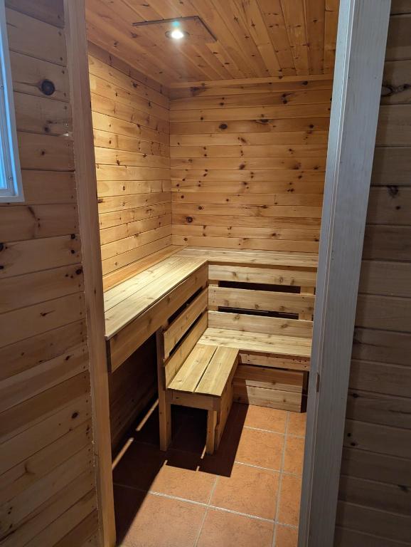 a wooden sauna with a bench in the middle at The Parrsboro Mansion Inn in Parrsboro