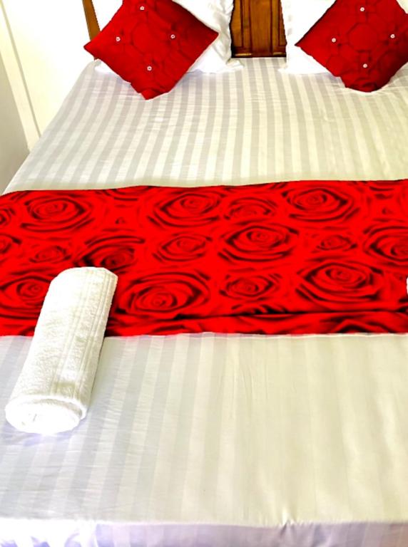 Postel nebo postele na pokoji v ubytování Ranuchanu Rockview Inn Ella