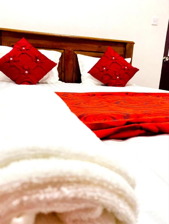 Postel nebo postele na pokoji v ubytování Ranuchanu Rockview Inn Ella