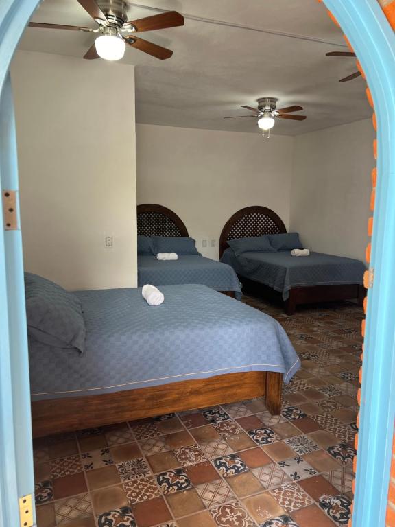 Postel nebo postele na pokoji v ubytování Casa Arcos Tepoztlán