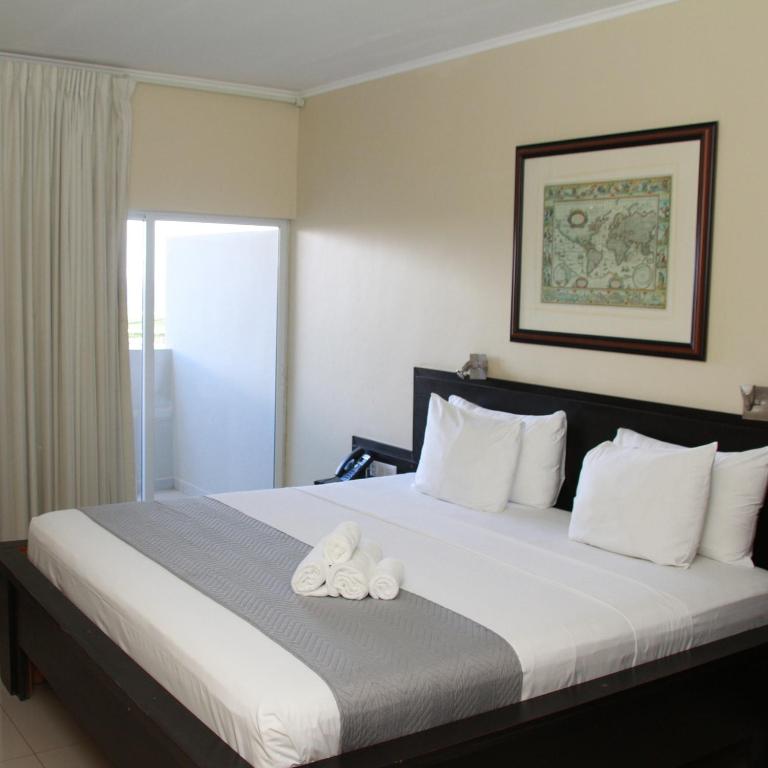 Postel nebo postele na pokoji v ubytování Curacao Airport Hotel