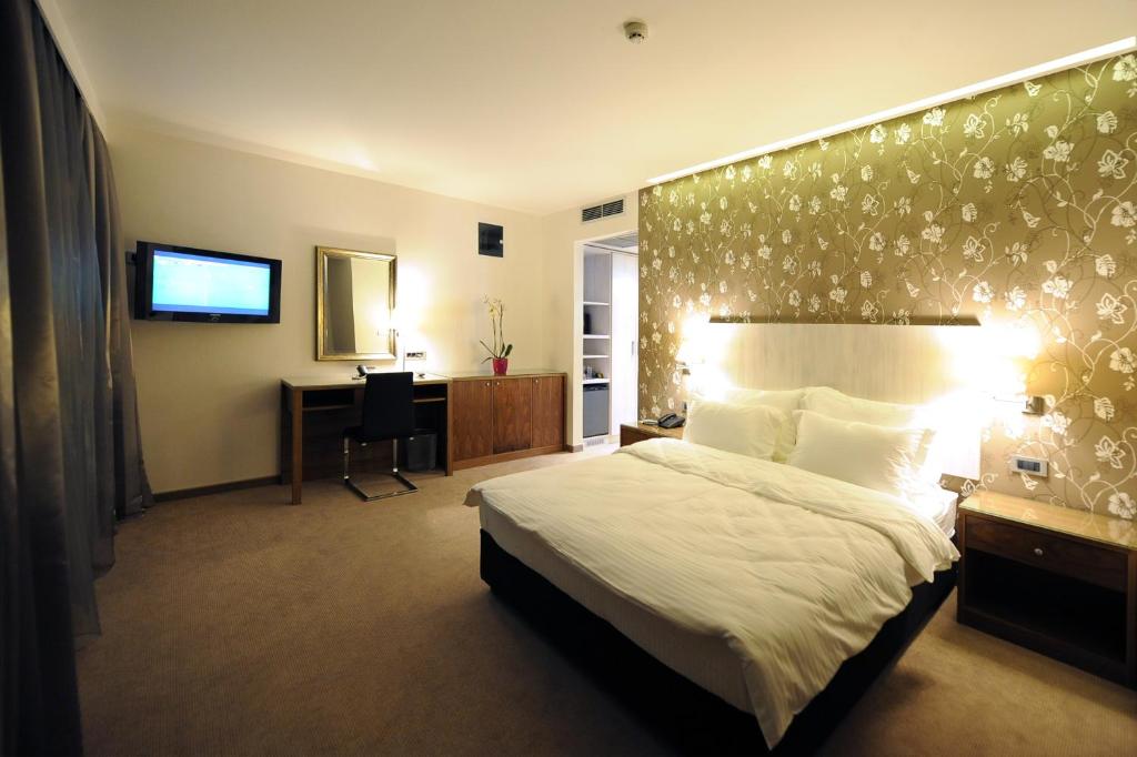 Postel nebo postele na pokoji v ubytování Hotel 1000 Ruza