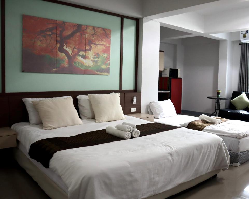 Ένα ή περισσότερα κρεβάτια σε δωμάτιο στο Aree Place Chiang Mai