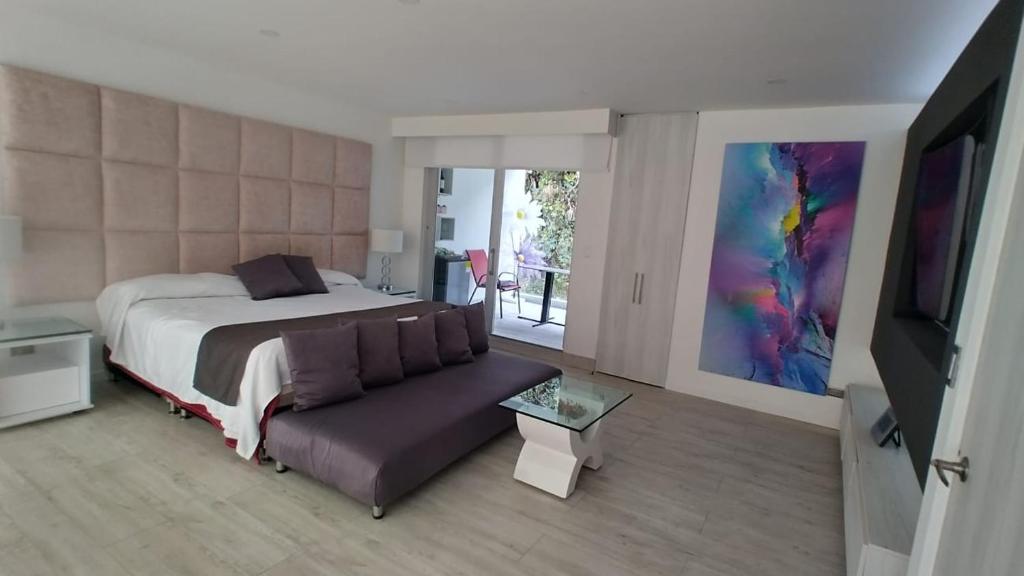 Postel nebo postele na pokoji v ubytování Mirador samsara Suite Luxury piso completo
