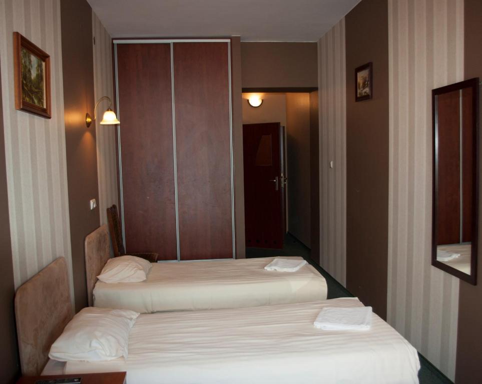 Postel nebo postele na pokoji v ubytování Hotel Nad Rzeczką