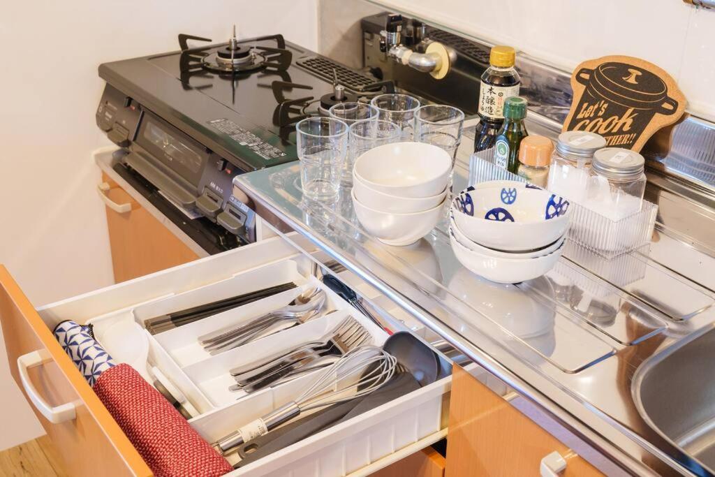 Kuchyň nebo kuchyňský kout v ubytování 名古屋城に1番近い名古屋市北区若鶴民泊