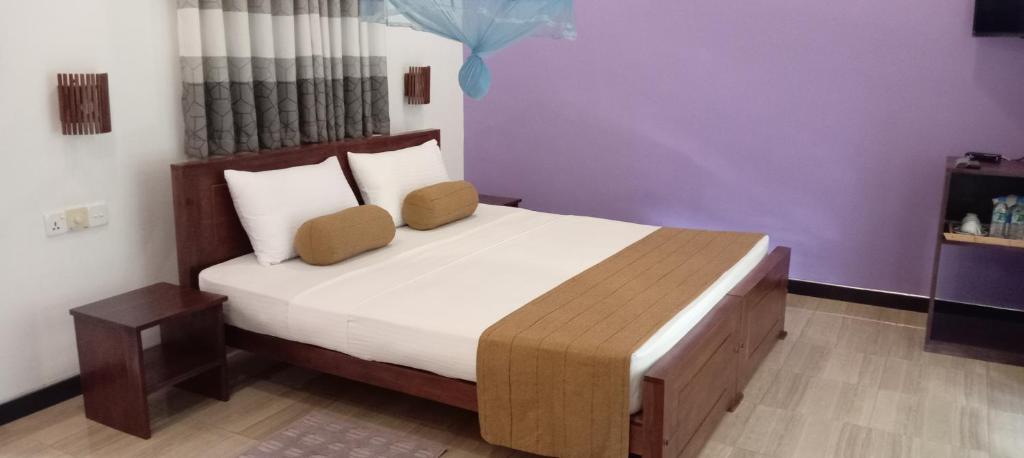 Postel nebo postele na pokoji v ubytování Peacock Lake Villa
