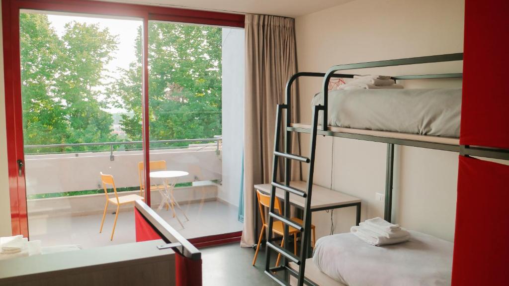 Postel nebo postele na pokoji v ubytování Le Magnolie