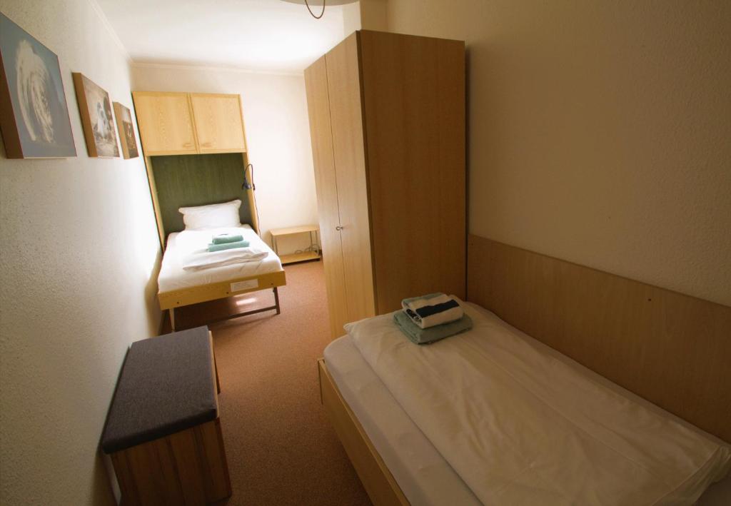 Postel nebo postele na pokoji v ubytování Haus Nordmeer