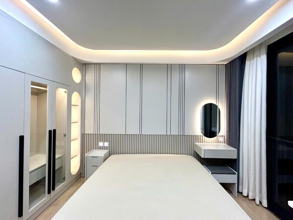 Postel nebo postele na pokoji v ubytování HOD Apartment Tan Dinh