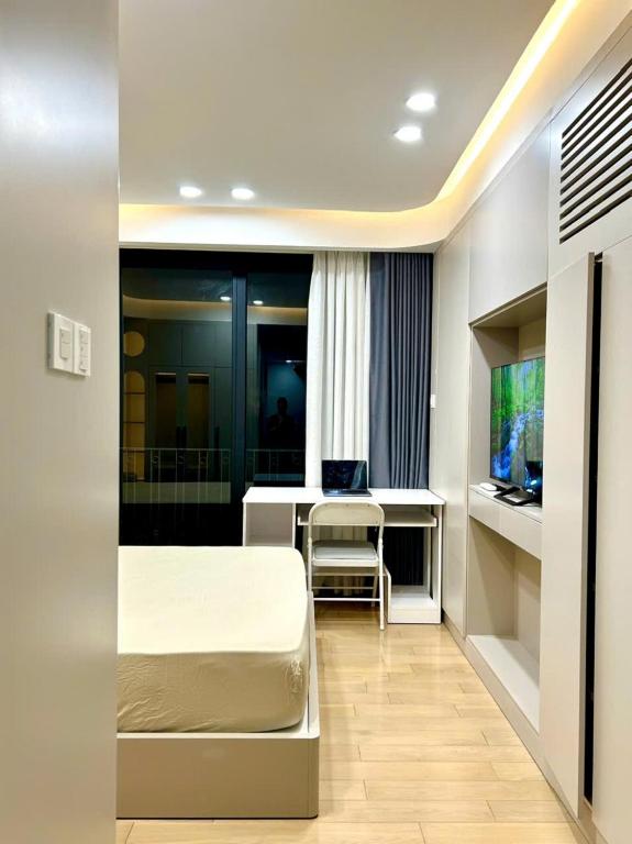TV a/nebo společenská místnost v ubytování HOD Apartment Tan Dinh