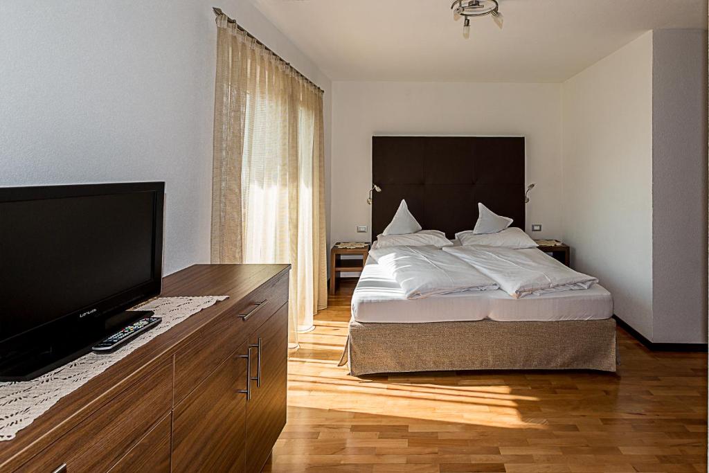 Postel nebo postele na pokoji v ubytování Garni Hotel Dorothea