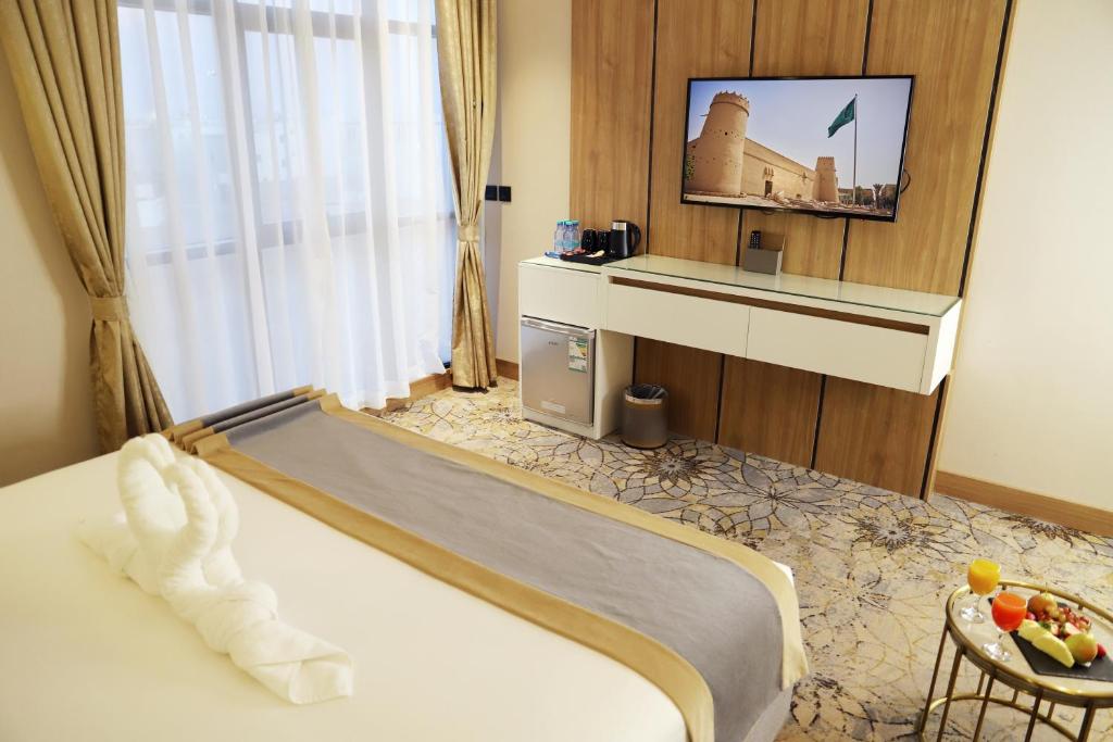 TV a/nebo společenská místnost v ubytování Ramadi Hotel