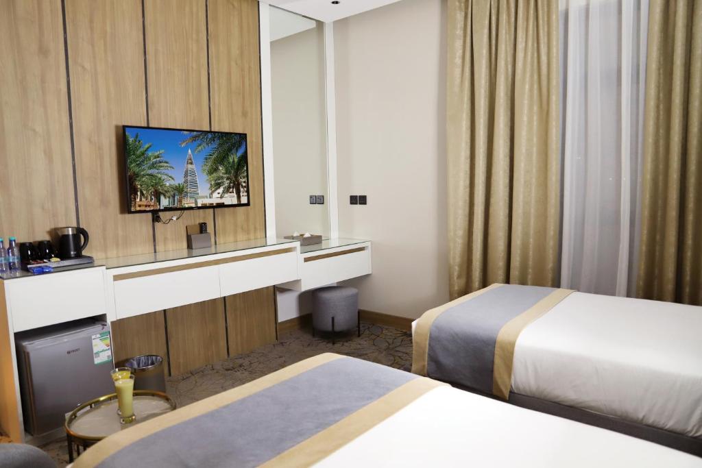 Postel nebo postele na pokoji v ubytování Ramadi Hotel