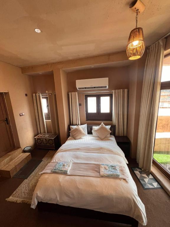Postel nebo postele na pokoji v ubytování Al Misfah Hospitality Inn