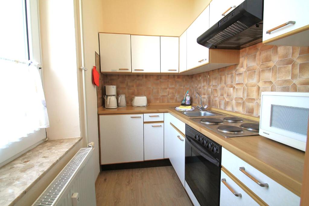 Kuchyň nebo kuchyňský kout v ubytování Haus Nordmeer