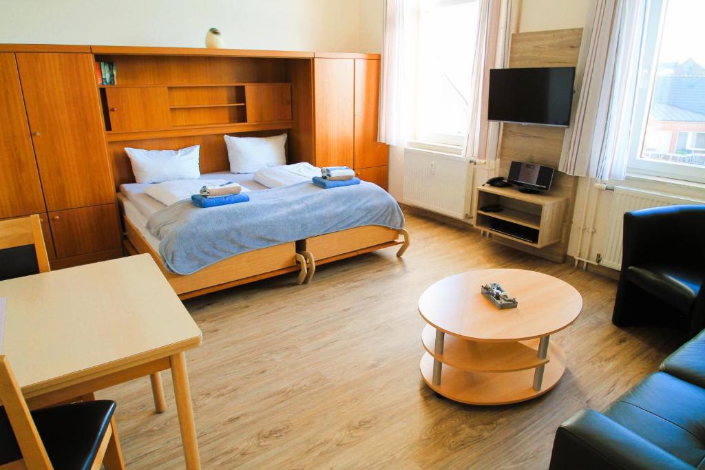 TV a/nebo společenská místnost v ubytování Haus Nordmeer