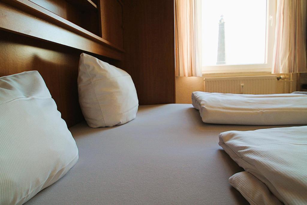 Postel nebo postele na pokoji v ubytování Haus Nordmeer