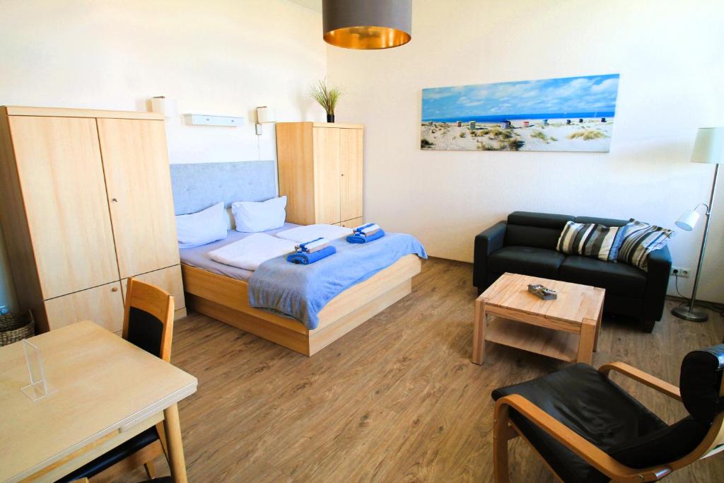 Postel nebo postele na pokoji v ubytování Haus Nordmeer