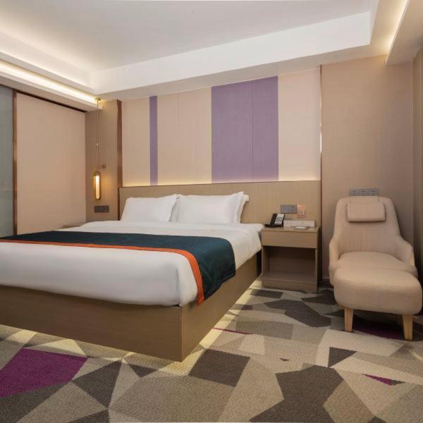Postel nebo postele na pokoji v ubytování Shenzhen Jincheng Hotel