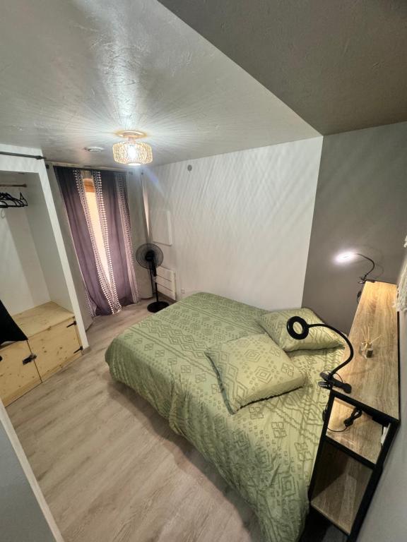 Postel nebo postele na pokoji v ubytování La Maisonnette