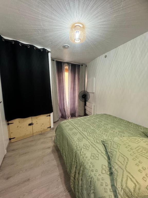 Postel nebo postele na pokoji v ubytování La Maisonnette