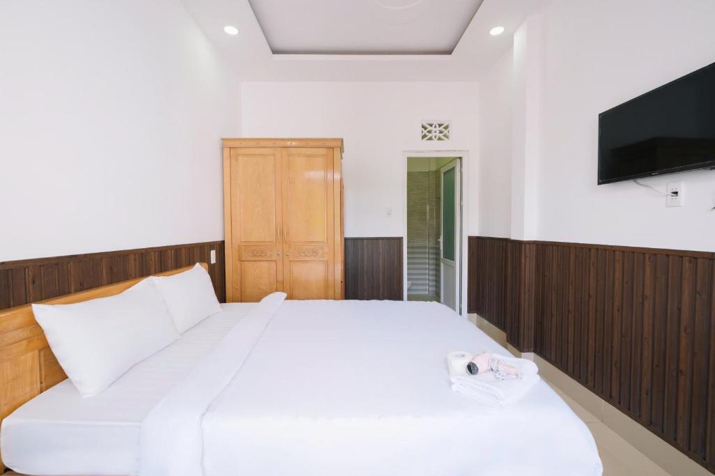 Giường trong phòng chung tại Cherry House Đà Lạt