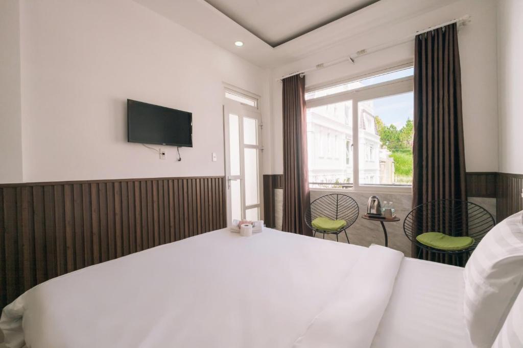 Giường trong phòng chung tại Cherry House Đà Lạt
