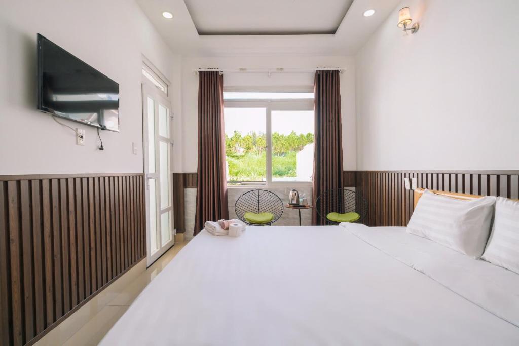 Giường trong phòng chung tại Cherry House Đà Lạt