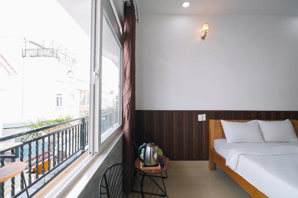 Giường trong phòng chung tại Cherry House Đà Lạt