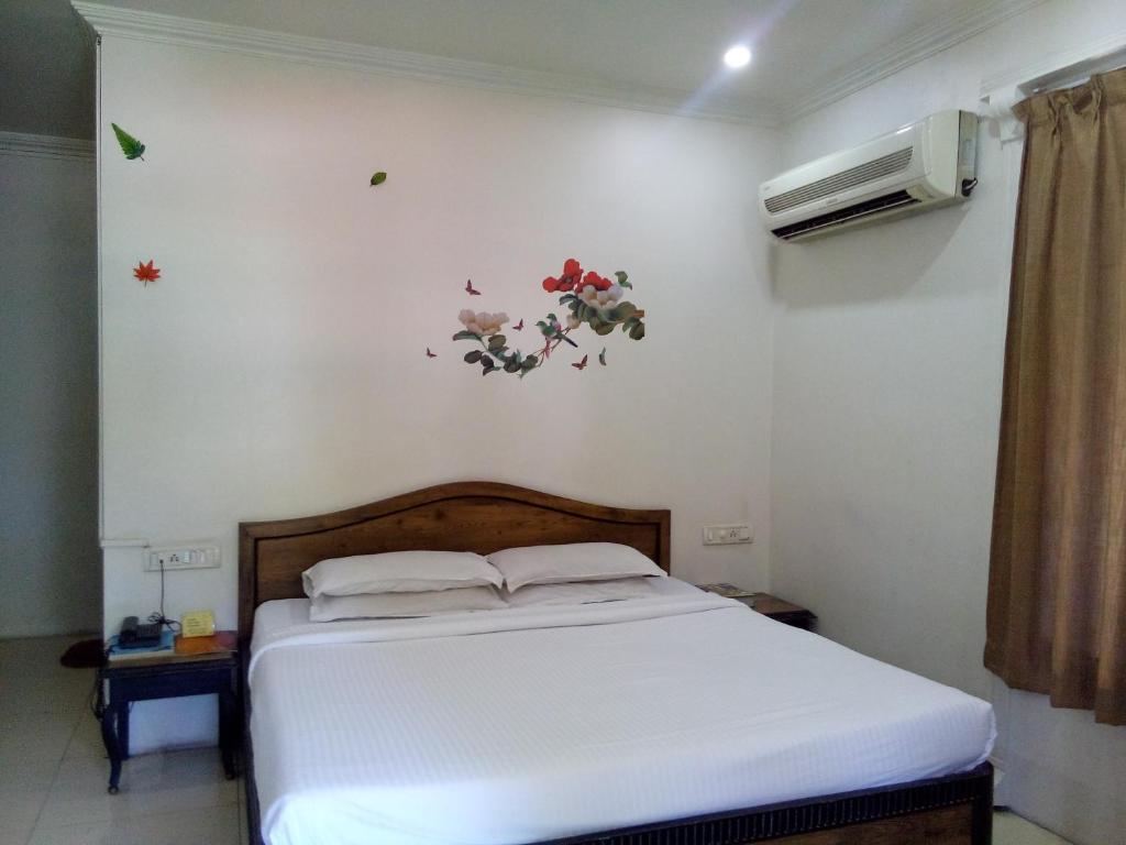 Postel nebo postele na pokoji v ubytování Hotel Ritz