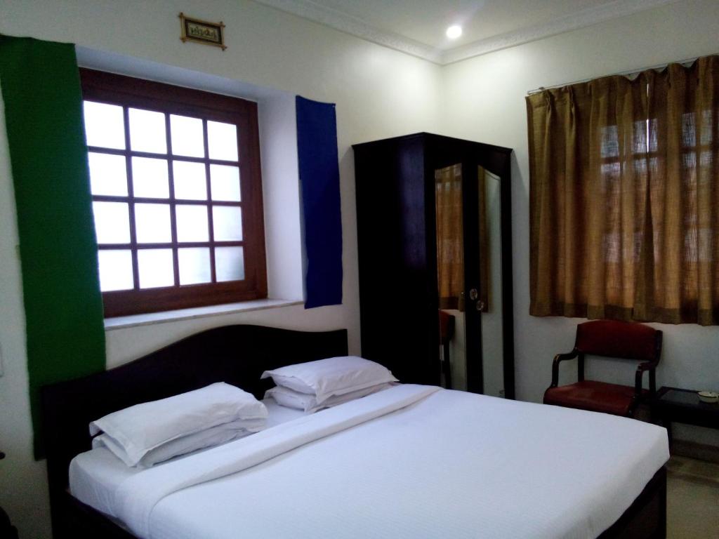 Postel nebo postele na pokoji v ubytování Hotel Ritz