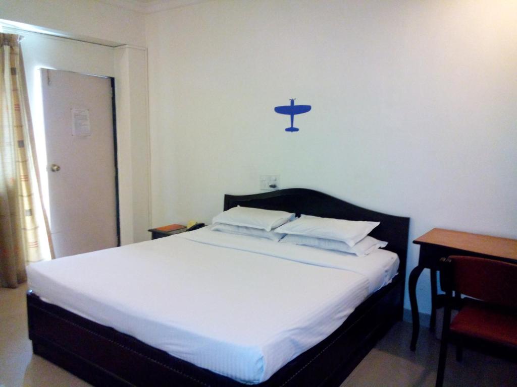 Postel nebo postele na pokoji v ubytování Hotel Ritz